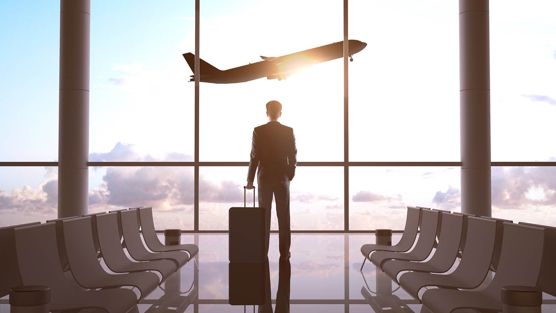 Corporate client watching a flight take off while waiting for thier flight